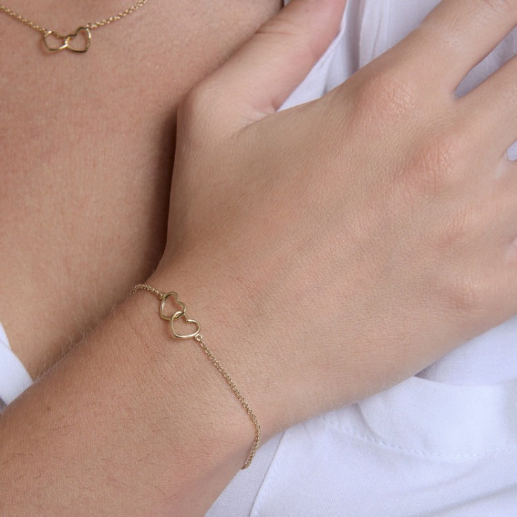 Bracciale Ginger in oro 9kt con cuore doppio incrociato in filo